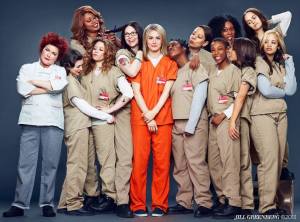 Piper Chapman (in orange) as the new inmate on the block in Netflix's Orange Is the New Black.