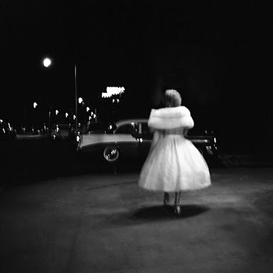 A stunning photo of a woman dressed for the evening. And what a car! Vivian Maier/John Maloof