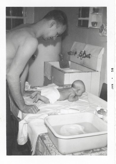 Daddy giving me a bath when I was a baby.